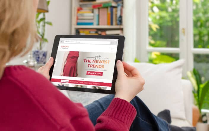 woman looking at ipad reading content marketing the newest trends